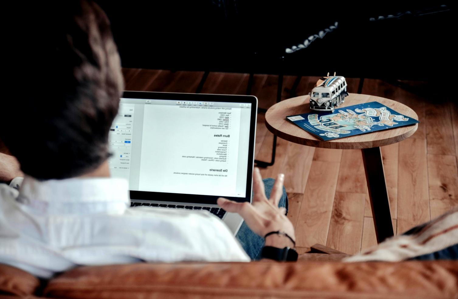 Financial professional analyzing complex portfolio data on computer screen with multiple analytical models displayed